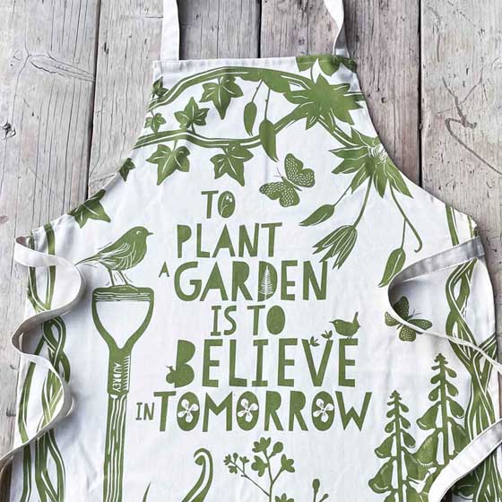 'To plant a garden' quote apron product photo side L