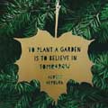 'To plant a garden' quote leaf ornament product photo back T