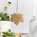 'To plant a garden' quote leaf ornament product photo front T